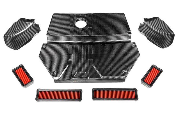 Car engine cover components with a carbon-fiber finish and "Venturi" text in the center. Four rectangular red air filters are positioned around the cover parts on a white background.