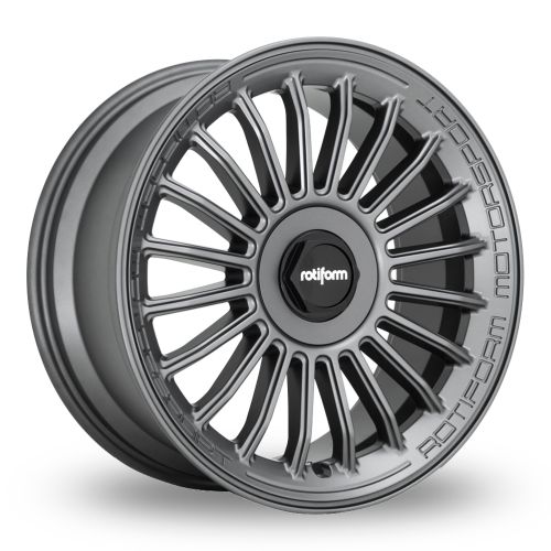 Dark grey car wheel rim with multi-spoke design. Center cap shows “rotiform” logo. Rim edge is engraved with “ROTIFORM MOTORSPORT.” Set against a plain, white background.