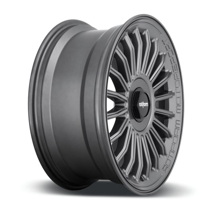 A gray alloy wheel with intricate spoke design is shown on a white background. "ROTIFORM MOTORSPORT" and "rotiform" are inscribed on the wheel's outer edge and center cap respectively.
