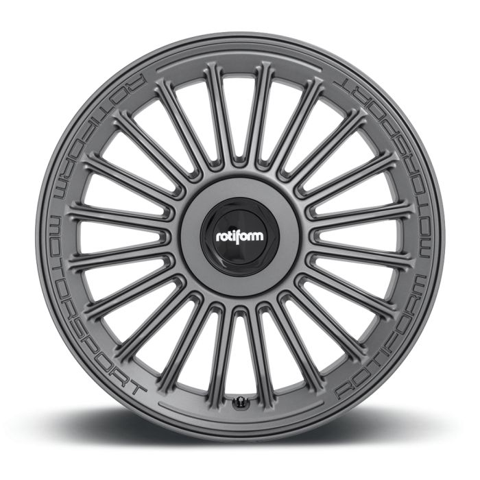 A silver alloy wheel with a multi-spoke design displays the text "rotiform MOTORSPORT" around its outer rim and "rotiform" on its central cap, set against a white background.