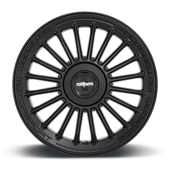 A black, multi-spoke alloy wheel; central hub displays "rotiform". Outer rim inscribed with "ROTIFORM MOTORSPORT". Positioned against a white background, the wheel is static and oriented upright.