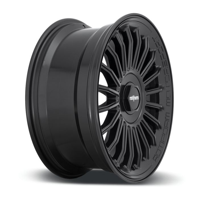 The black alloy car wheel is static against a white background. It has a multi-spoke design with the word "rotiform" at its center and "ROTFORM MOTORSPORT" engraved around the rim.