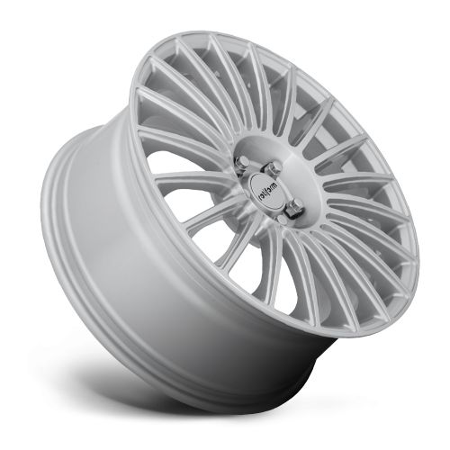 Silver car wheel rim, with a complex multi-spoke design, leaning against a white background. The center features a circular emblem with "rotiform" text.