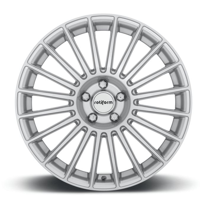 A silver alloy wheel with numerous thin spokes radiating from a central hub, featuring the text "rotiform"; the object is displayed against a plain white background.