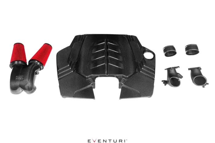Carbon fiber engine cover and dual red air filters in a white, Eventuri-branded setting with additional black components.