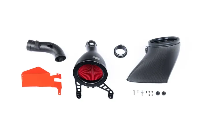 Car air intake system components, including a large black cylindrical part with a red filter, several curved black tubes, a red flat piece, and assorted small screws arranged on a white background.