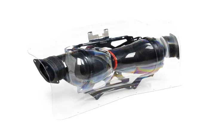 Dual exhaust pipes encased in a clear protective cover, with black connectors and a metallic iridescent finish, shown against a white background.
