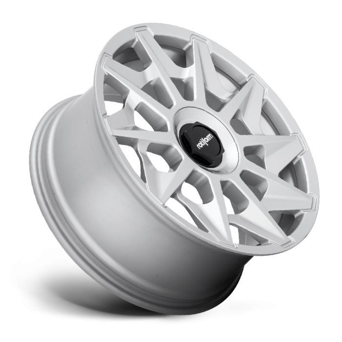 A white alloy wheel with intricate, angular spokes, positioned at an angle on a white background. The center cap features a black emblem with the text "rotiform."