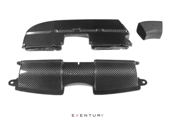 Carbon fiber engine components are arranged on a white background. One piece is a large, curved cover, while the other appears to be a two-part shield. "EVENTURI" text below.
