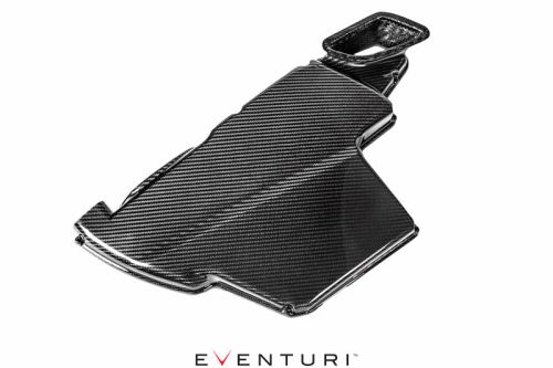 A carbon fiber automotive component rests on a white background. Text: "EVENTURI" appears below the part in black and red letters.