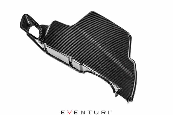 A carbon fiber vehicle part, possibly an air intake cover, lies against a white background with "EVENTURI" written below it.