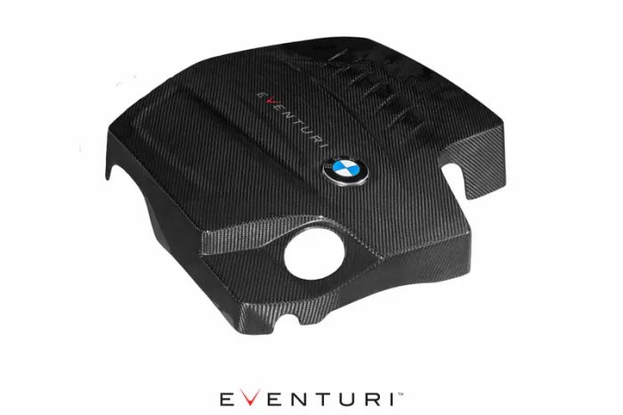 Carbon fiber engine cover with BMW logo and “Eventuri” text, shown on a plain white background. EVENTURI is written at the bottom in large text.