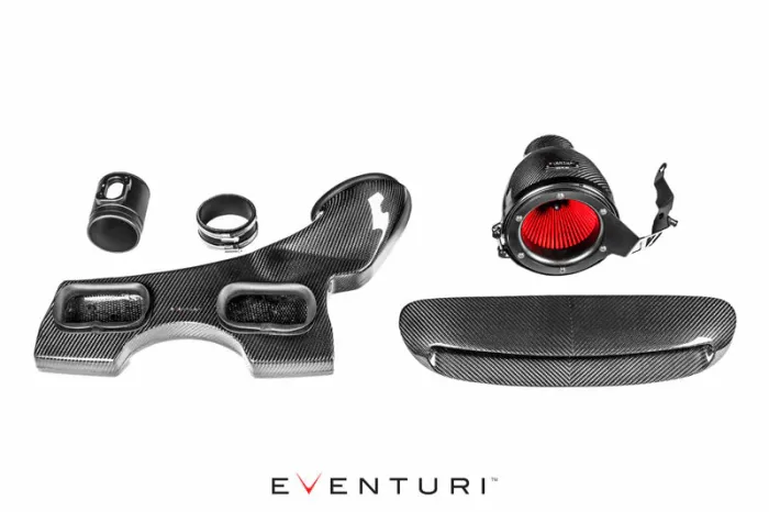 Carbon fiber automotive intake components are laid on a white background. Items include a red filter cone, various shaped ducts, and couplings. The text "EVENTURI" is prominently displayed below the items.