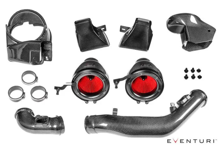 Carbon fiber car intake kit components, featuring red air filters, tubing, and mounting brackets, arranged neatly on a white background. Text reads: "EVENTURI".