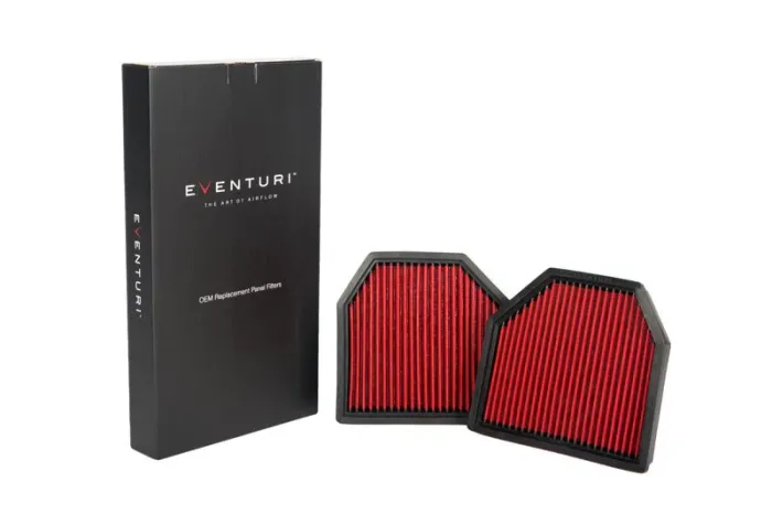 Two red automotive air filters with black frames lie next to a black box labeled "Eventuri® - The Art of Airflow - OEM Replacement Panel Filters" on a white background.