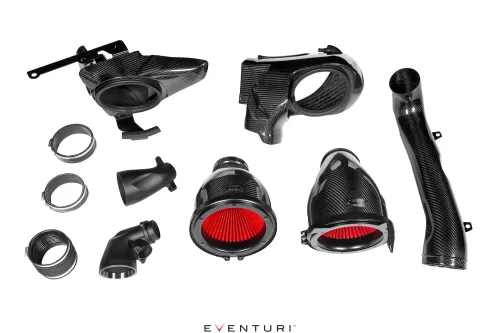 Carbon fiber automotive air intake components, including ducts, cones, and tubes, are displayed on a white background. Two primary filters with red pleats are prominent. Text: "EVENTURI" at the bottom center.
