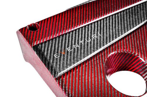 A red and black carbon fiber automotive part with the text "EVENTURI" on it, featuring diagonal patterns, a hole, and a bolt hole, against a white background.