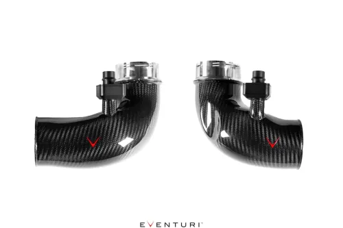 Two carbon fiber intake pipes with black fittings and clear ends are displayed against a white background. Red checkmarks are visible on both pipes. The text reads "Eventuri."