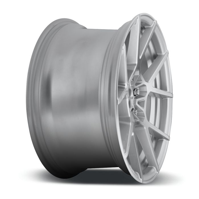 A silver, multi-spoke car wheel rim is displayed on a white background, showing its profile and detailing.