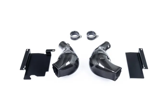 Two carbon fiber car air intakes are flanked by black metal brackets and two rubber hose clamps labeled "Eventuri" on a plain white background.