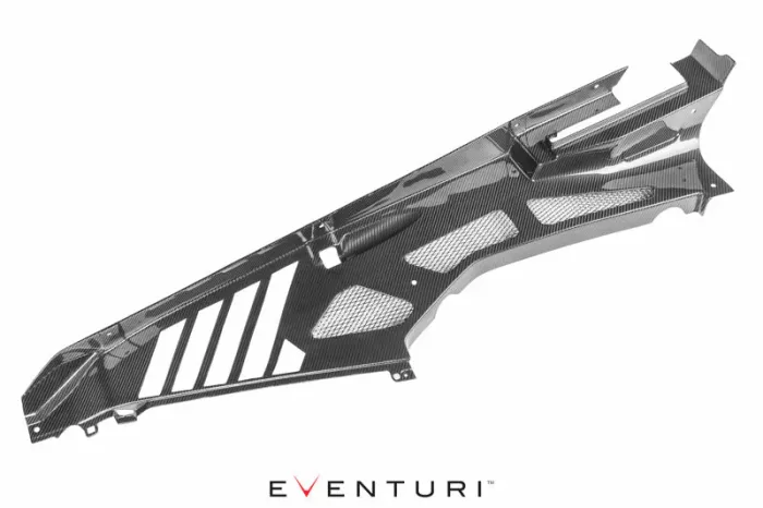 A dark, carbon-fiber automotive part with venting holes and angled design; resting on a white background. Text: "EVENTURI" at the bottom.