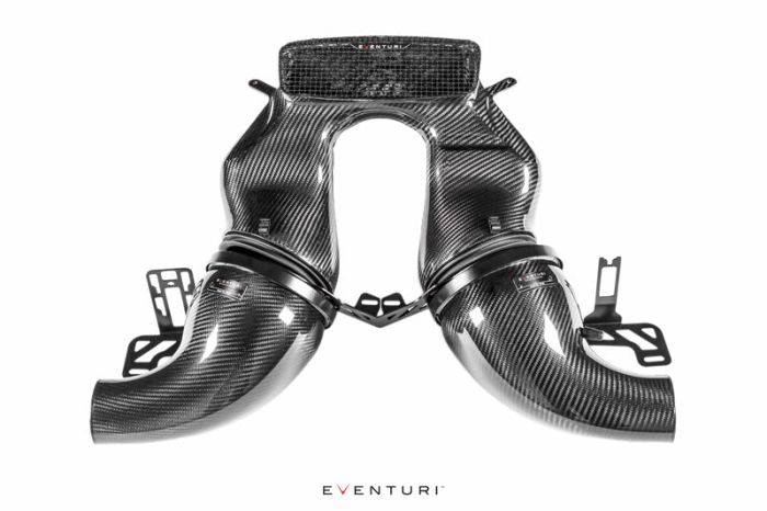 Carbon fiber dual intake system with curved ducts, black detailing, and the brand name "Eventuri" on a white background. Multiple mounting brackets are visible. "Eventuri" text appears twice.