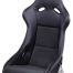 A black Recaro racing seat is displayed on a plain white background, featuring a reclining design with side support bolsters, high backrest, and padded seating for comfort and safety.