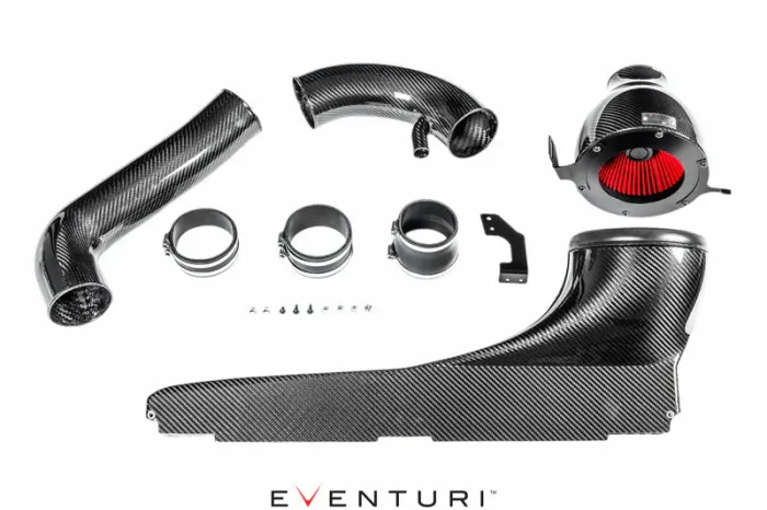 Carbon fiber car air intake components including pipes, hoses, clamps, and a red air filter arranged on a white surface. "EVENTURI" text at the bottom.