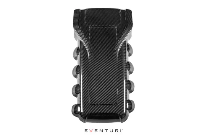A carbon fiber engine cover with a sleek, geometric design rests on a white background. The text "EVENTURI" is displayed below it in a modern font.