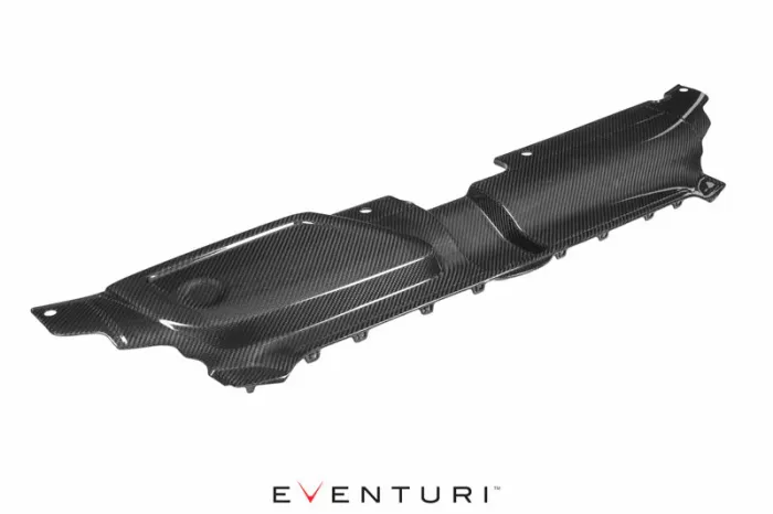 A carbon fiber engine cover is displayed on a white background. It is smooth, black with visible fiber patterns. The text "EVENTURI" appears below the object.