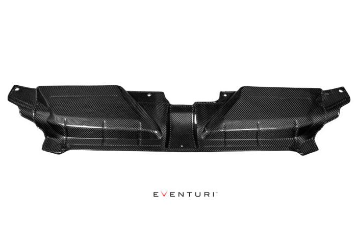 A black carbon fiber car engine cover with grooves and contours lies against a white background. Below the cover, the text "EVENTURI" is written.