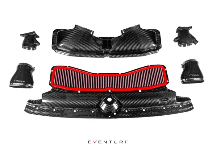 Carbon fiber car air intake system, including components like the air filter, ducts, and tubes, highlighted by a central red air filter. Text: "EVENTURI" on components. White background.