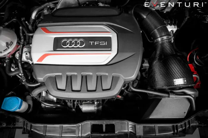 An Audi TFSI engine is positioned centrally with detailed intake and components surrounding it; the brand logo appears prominently on the engine cover. Text reads "EVENTURI" in the top right corner.