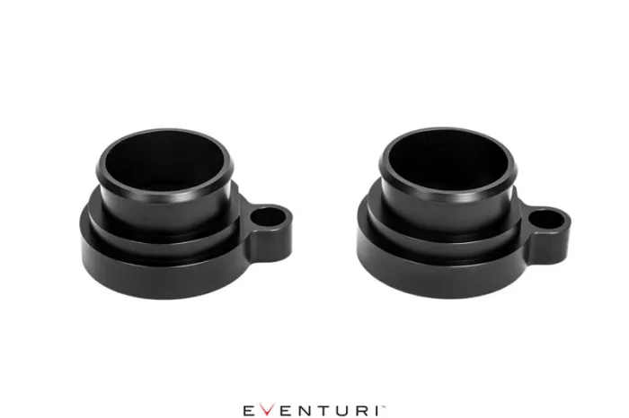 Two black cylindrical, machined metal components with flanges and mounting holes are set against a white background. Text below reads "EVENTURI."