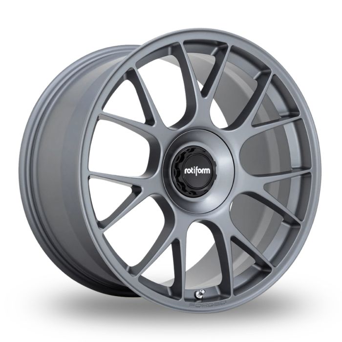 Grey car wheel rim with multi-spoke design, displaying the "rotiform" logo at the center. Solid backdrop emphasizes the sleek, modern appearance and details of the rim.