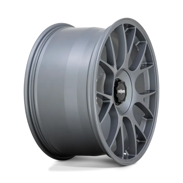 A silver, multi-spoke car wheel with "rotiform" printed on the black center cap, displayed against a gradient background.