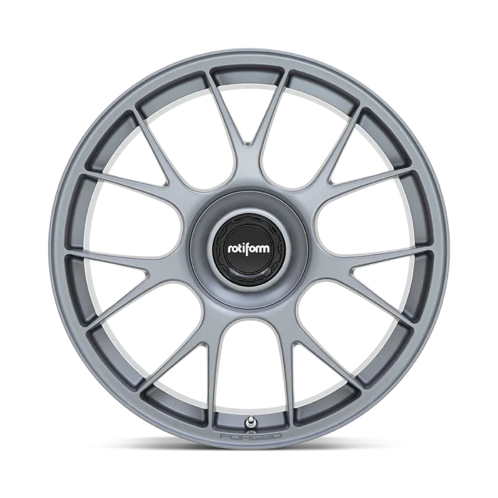 A silver alloy car wheel with thin radial spokes against a plain background. The center cap reads "rotiform," and "FORGED" is inscribed on the bottom edge.