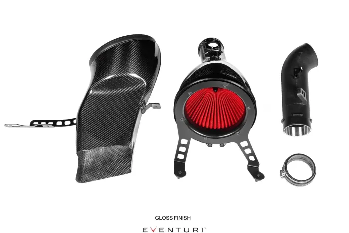 Carbon fiber air intake system components including a curved air duct, a circular red air filter with a black housing, a connecting tube, and a clamp; labeled "GLOSS FINISH" and "EVENTURI."