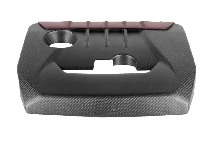 A carbon fiber engine cover features ribbed detail and a red accent at the top, with cutouts for engine components. The word "VENTURI" is visible at the bottom center.
