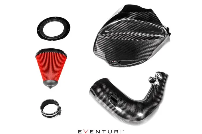 Carbon fiber performance air intake kit components arranged on a white background, including a red cone filter, circular adapter, intake pipe, and airbox. Text: "EVENTURI."