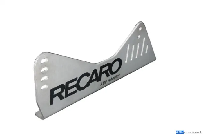 Metal seat bracket labeled "RECARO ABE Adapter," featuring bolt slots and adjustment holes, displayed against a white background. "APMotorsport" logo appears at the bottom right corner.