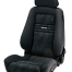 A black bucket car seat with the brand name "RECARO" on its backrest; equipped with side bolsters, headrest, and a patterned fabric cover, positioned in an isolated setting.