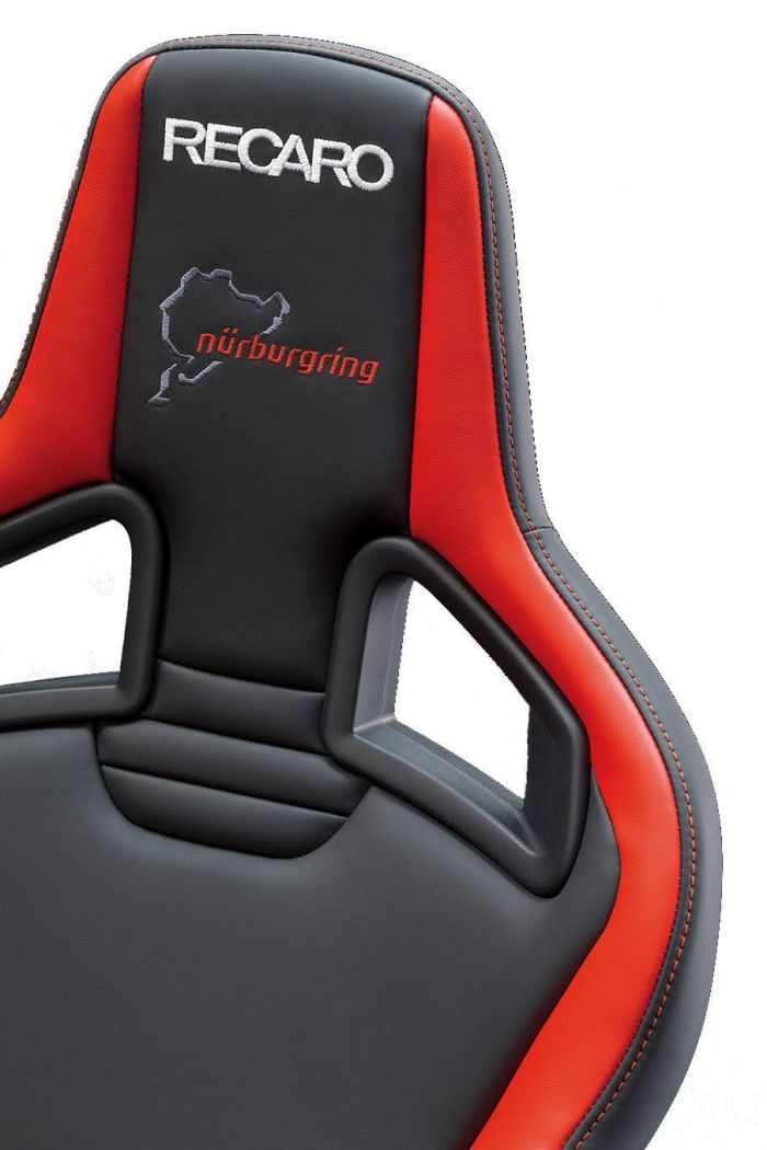 A racing seat in black with red accents and embroidered logos that read "RECARO" and "nürburgring" with a track outline, set against a white background.