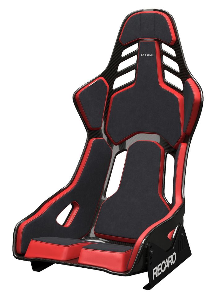 Black and red racing seat with cutouts, angled backrest, and side supports. Text "RECARO" appears on the headrest and seat base. Context is a plain, white background.