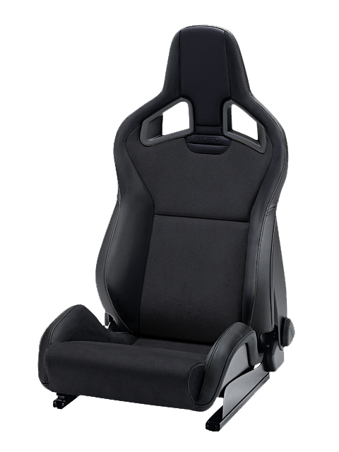 A black racing car seat with integrated headrest and side bolsters stands isolated on a white background. The word "RECARO" is embossed at the top center.