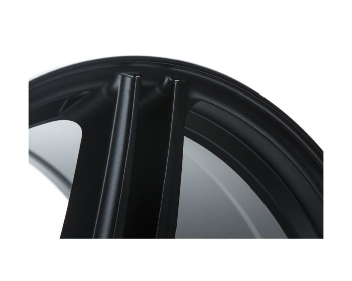 A close-up view of a sleek, black car wheel rim showing its curved structure, highlighted against a plain white background, emphasizing its design and texture.