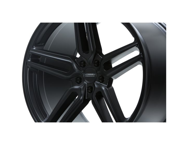 A black alloy wheel with a multi-spoke design, featuring the branding "VOSSEN HYBRID FORGED" at the center, is displayed against a plain white background.