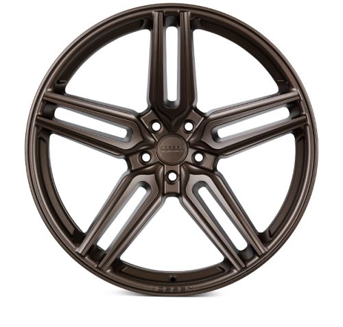 A bronze-colored, multi-spoke alloy wheel with stylized cutouts and a central hub reading "ZEIT WHEELS." The wheel rests against a plain white backdrop, showcasing its design detail.