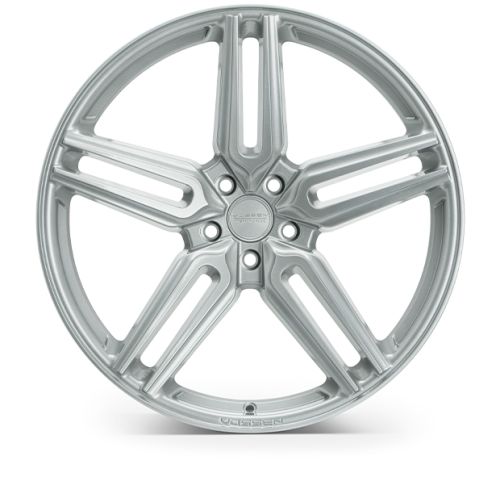 A silver alloy wheel with five spokes rests against a plain white background. Engraved text reads: "VOSSEN HYBRID FORGED" in the center, and "VOSSEN" at the bottom rim.