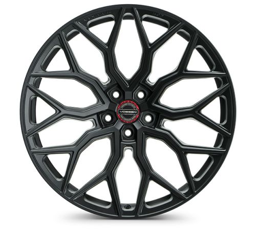 A black alloy car wheel features intricate, spoke-like patterns radiating from the center. The center cap displays the text "VOSSEN," with additional text "FORGED SERIES" at the rim edges.